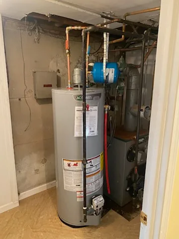 A.O. Smith gas water heater installed in a utility closet