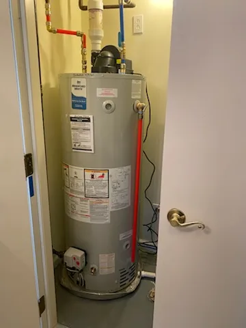 Bradford White gas water heater installed in a closet